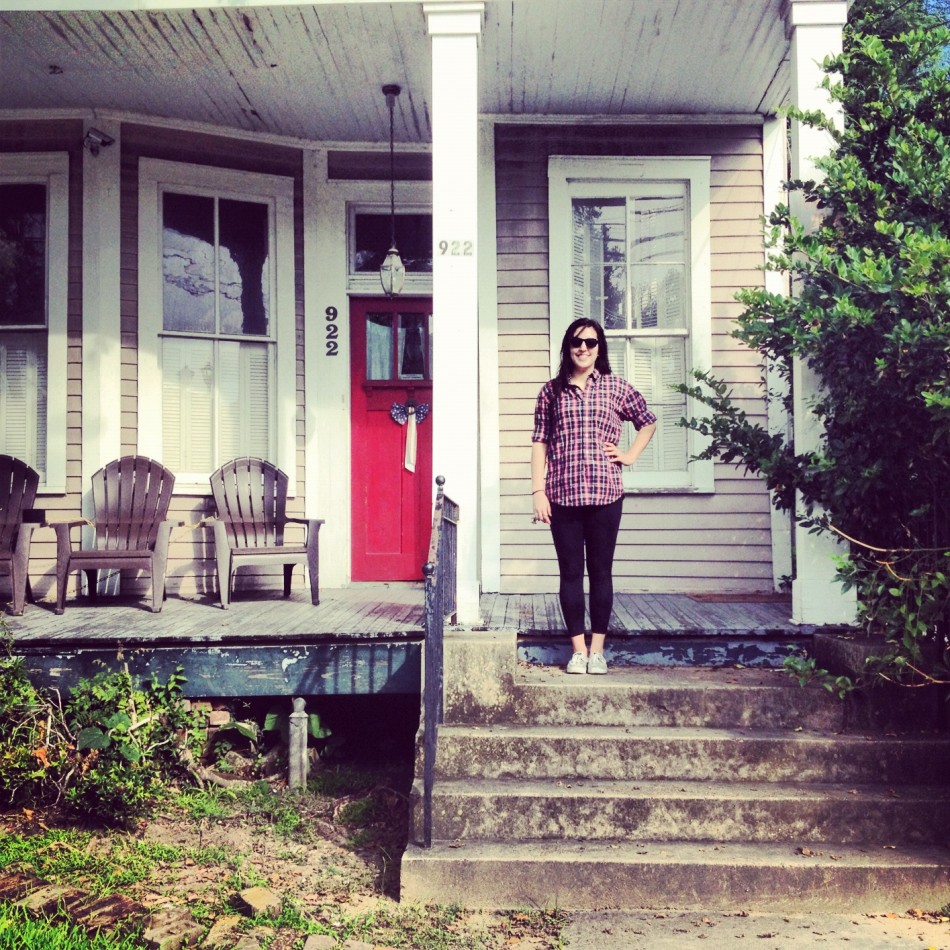 The author stands in front of her home in New Orleans.