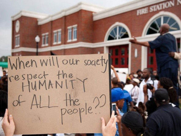 Protestors rally Sunday, Aug. 10, 2014 to protest the shooting of Michael Brown, 18, by police in Ferguson, Mo. (Photo Courtesy of Sid Hastings/ABC News)