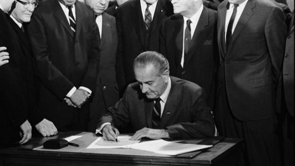 Lyndon signs Civil Rights Act